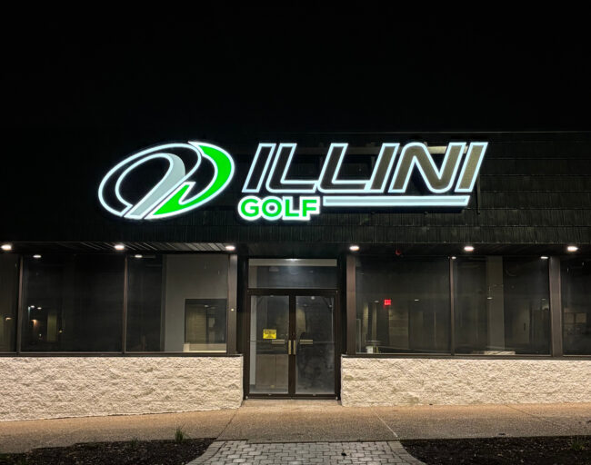 The outside of the Illini Golf facility at night
